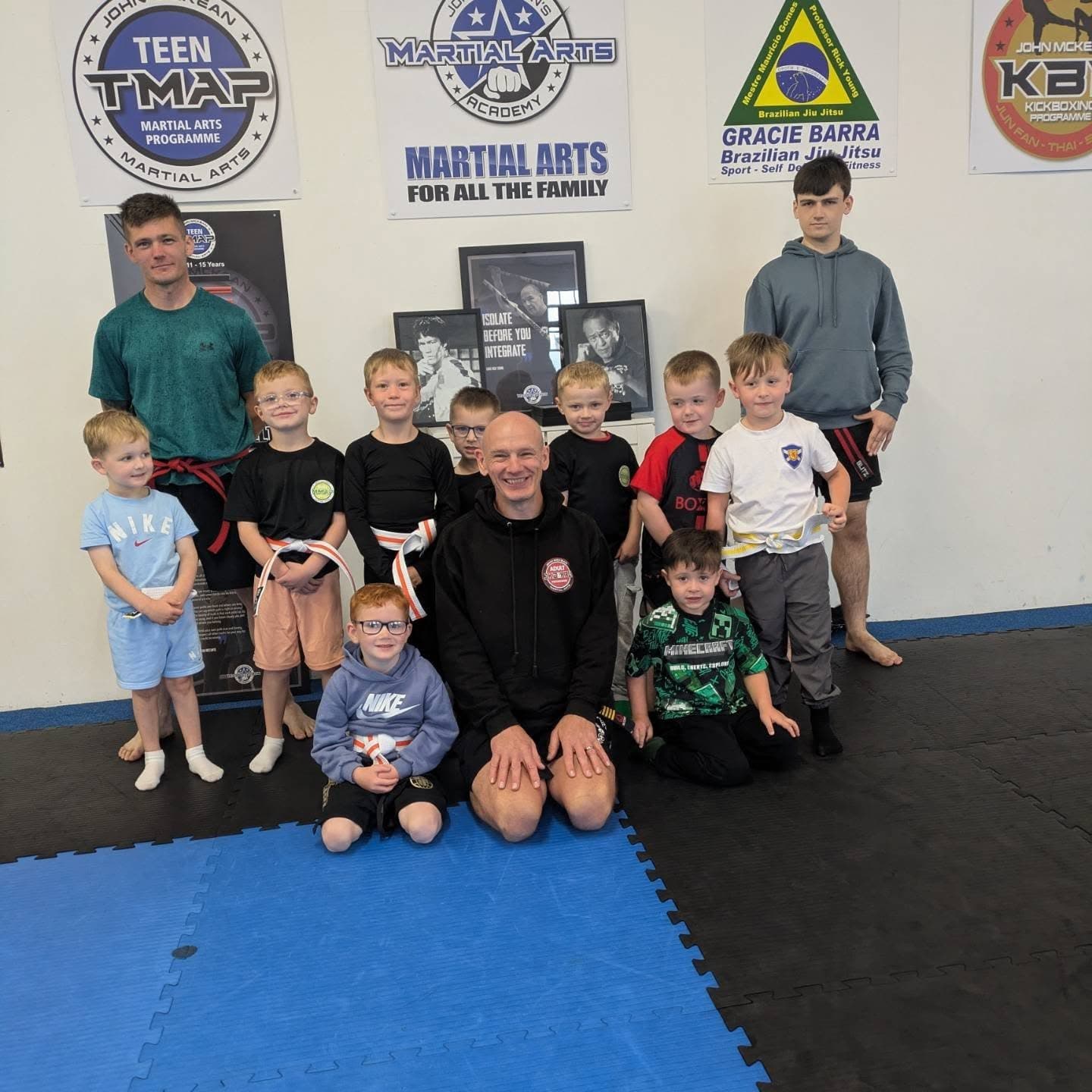 Junior martial arts students and coaches at John McKean Academy