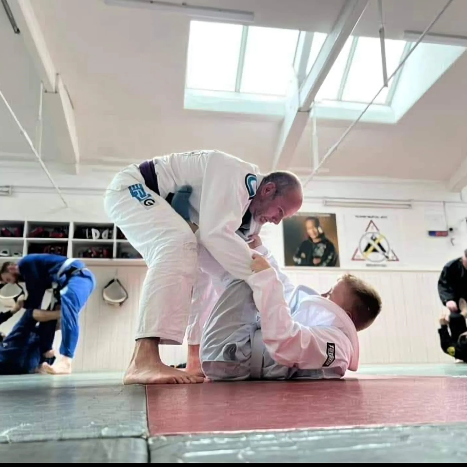 John coaching Brazilian jiu-jitsu on the mat