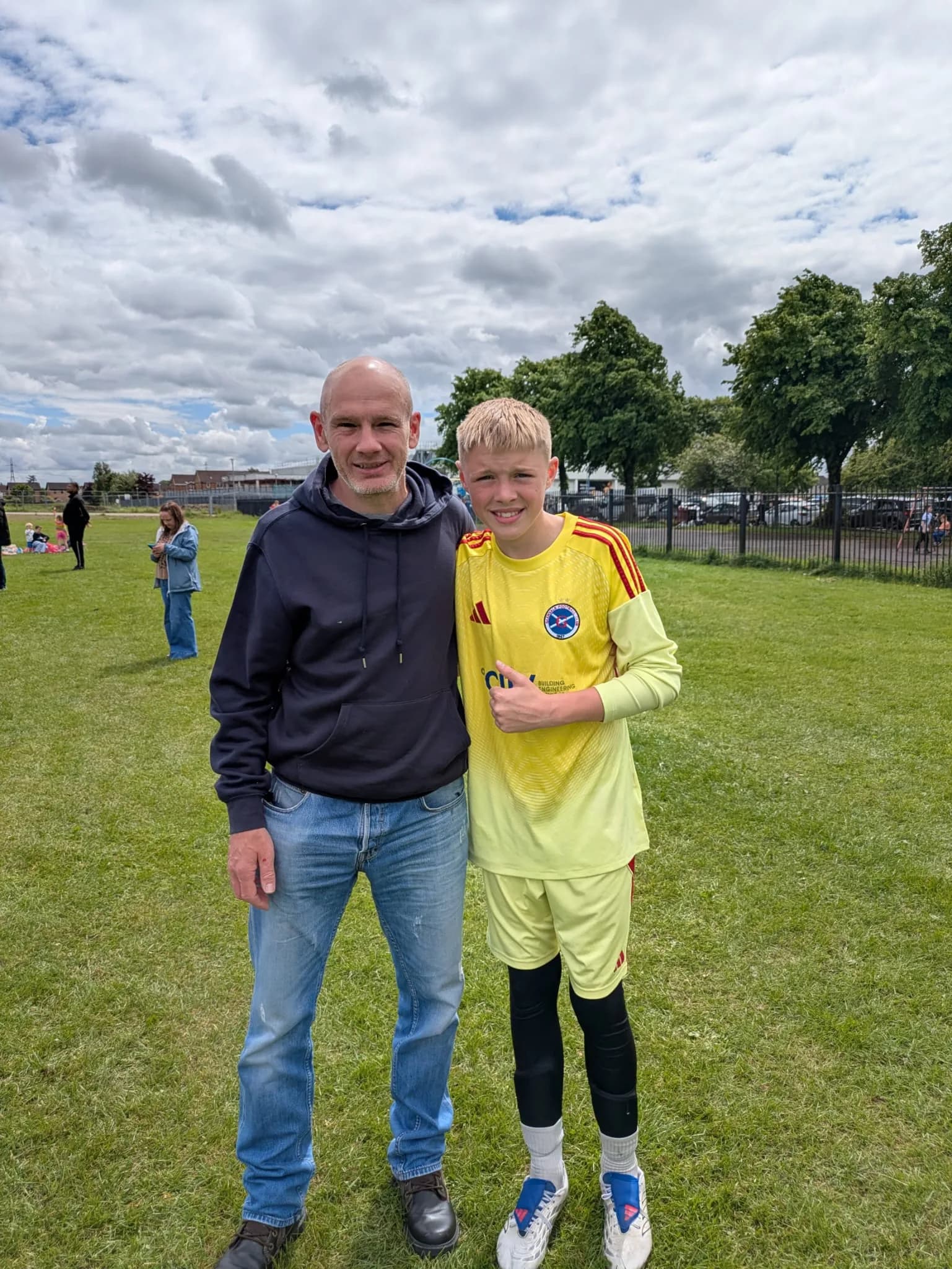 A father and son together at a football match